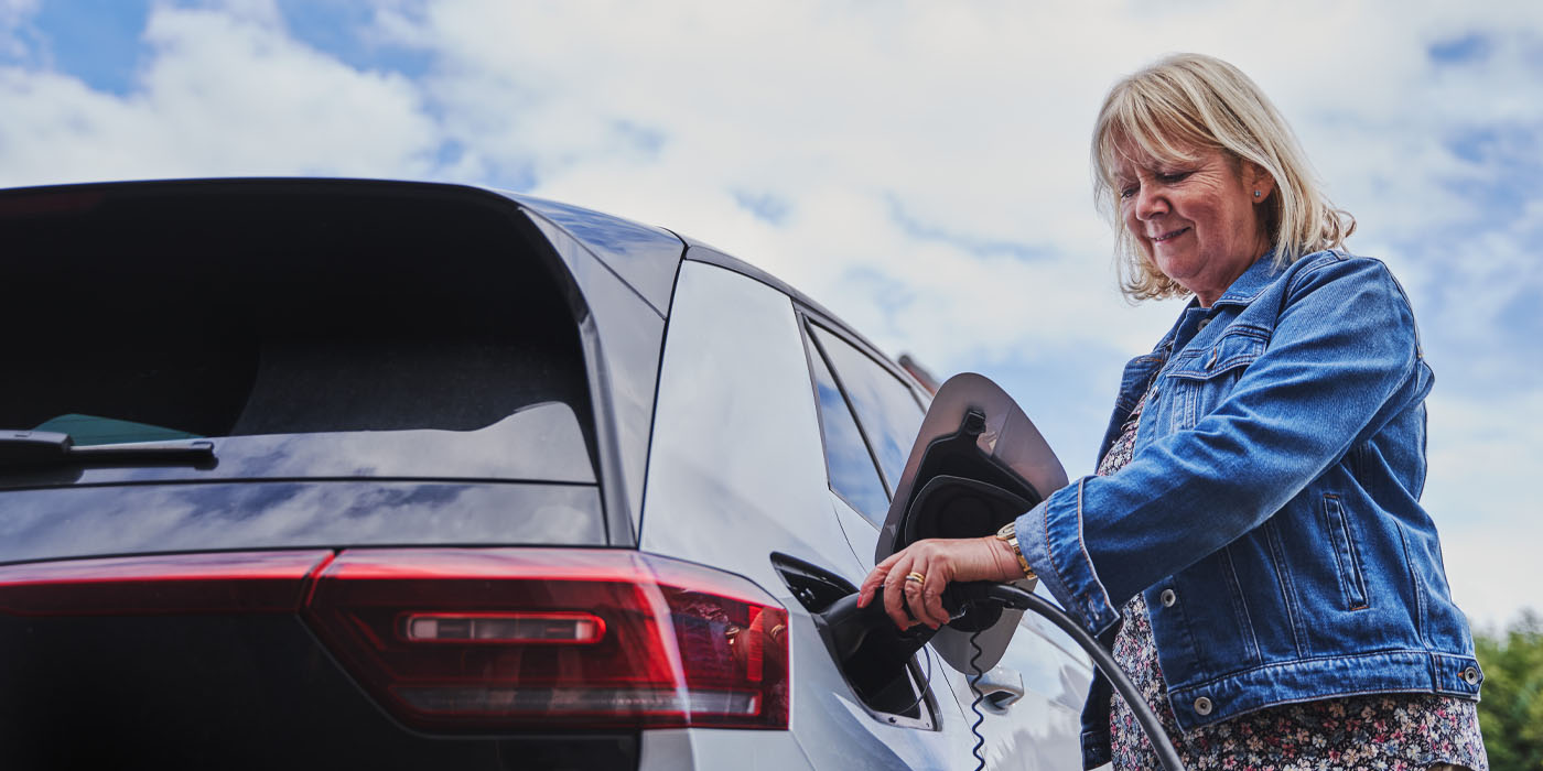 Customer charging electric vehicle