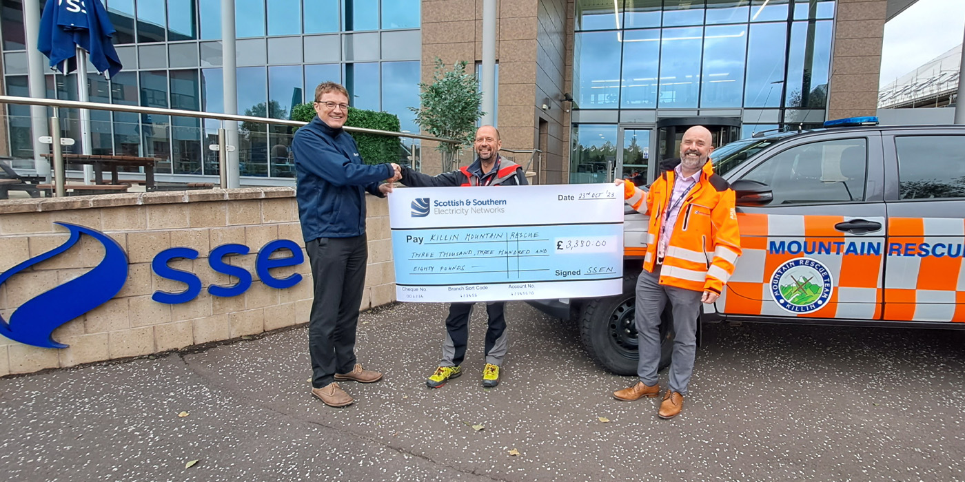 Andy, Joe and Richard holding a Cheque