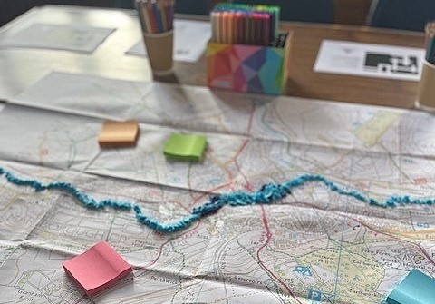 Paper map and notes showing flood area