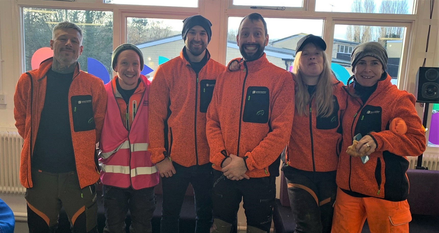 Group shot of men and women in PPE