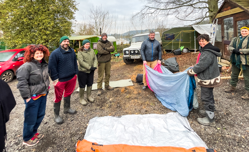 Volunteers outdoors doing first aid training