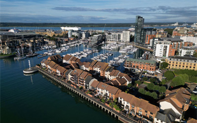 An aerial view of Southampton, showing the city's waterside, housing, and commercial area from above