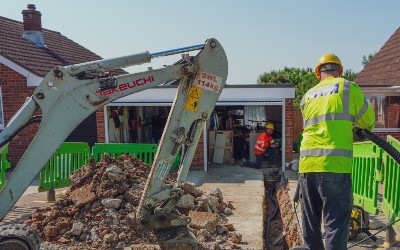 SSEN engineers work in a domestic property's driveway to unloop an electricity supply