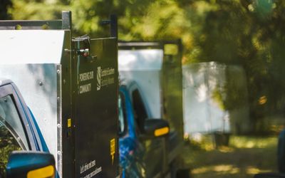 Images of SSEN vehicles parked in a rural environment