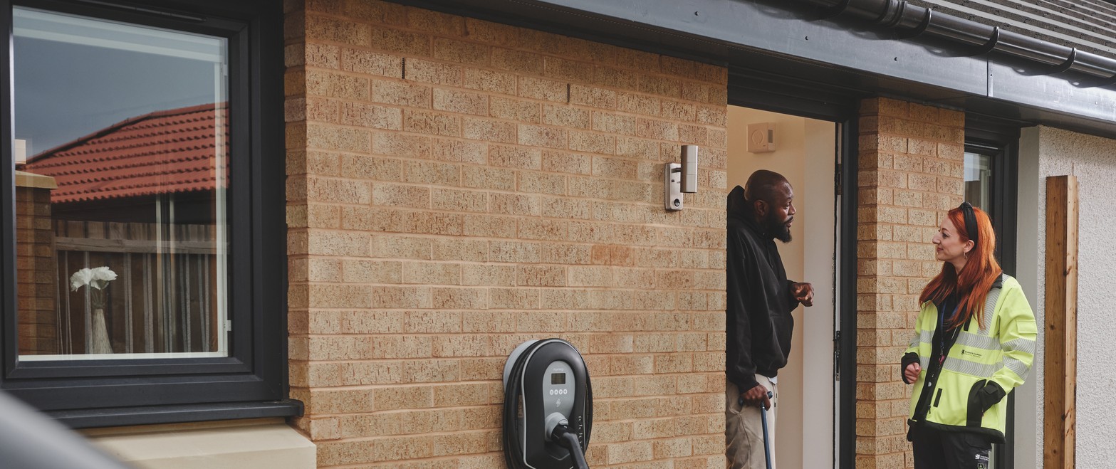 SSEN engineer speaking with customer at their property