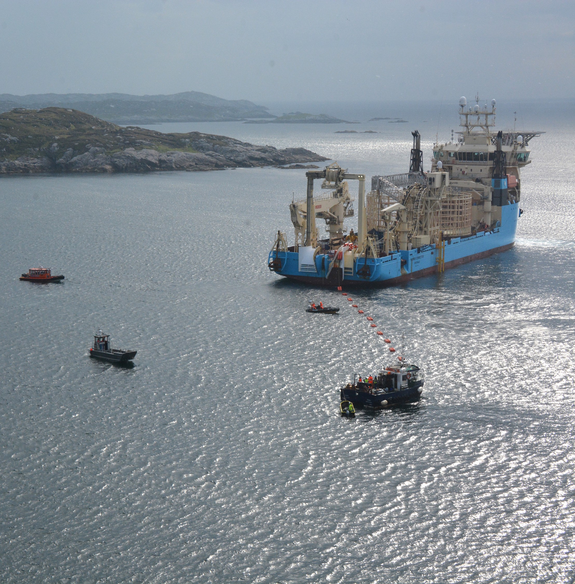 Large ship next to sub cables